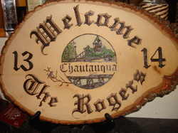 Wood burned welcome sign colored with oil  pencil on basswood round.
